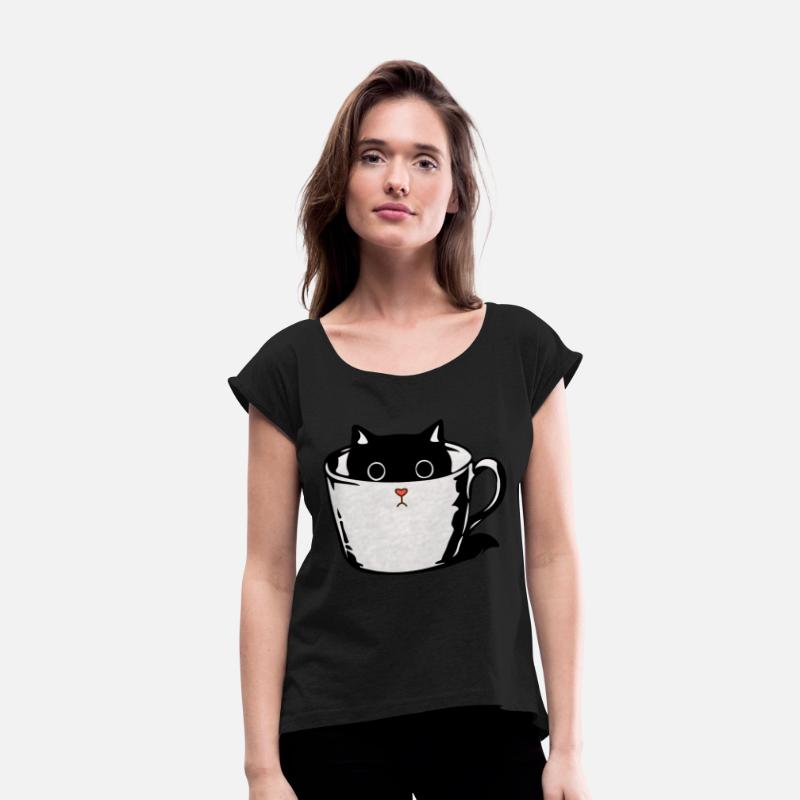 Black kitten with red nose hiding in a cup