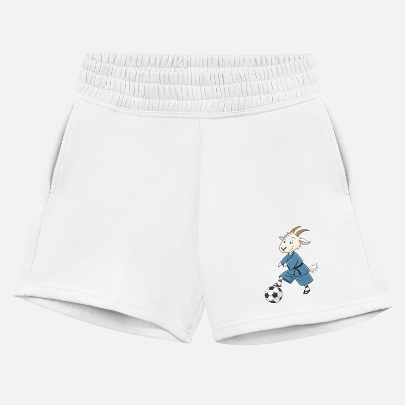 Goat playing soccer in karate kimono