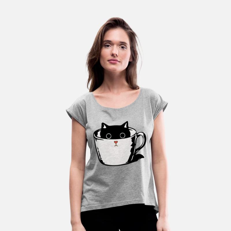 Black kitten with red nose hiding in a cup