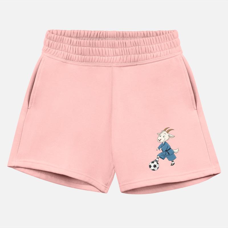 Goat playing soccer in karate kimono