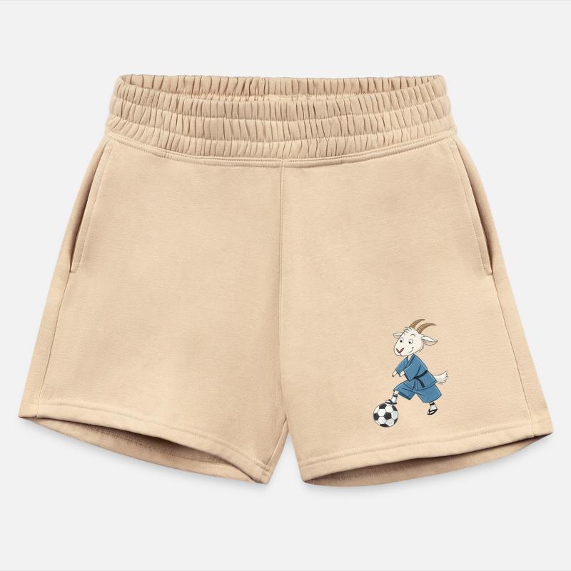 Goat playing soccer in karate kimono