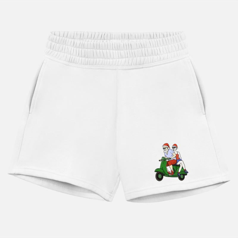 Santa and Mrs. Claus riding a scooter