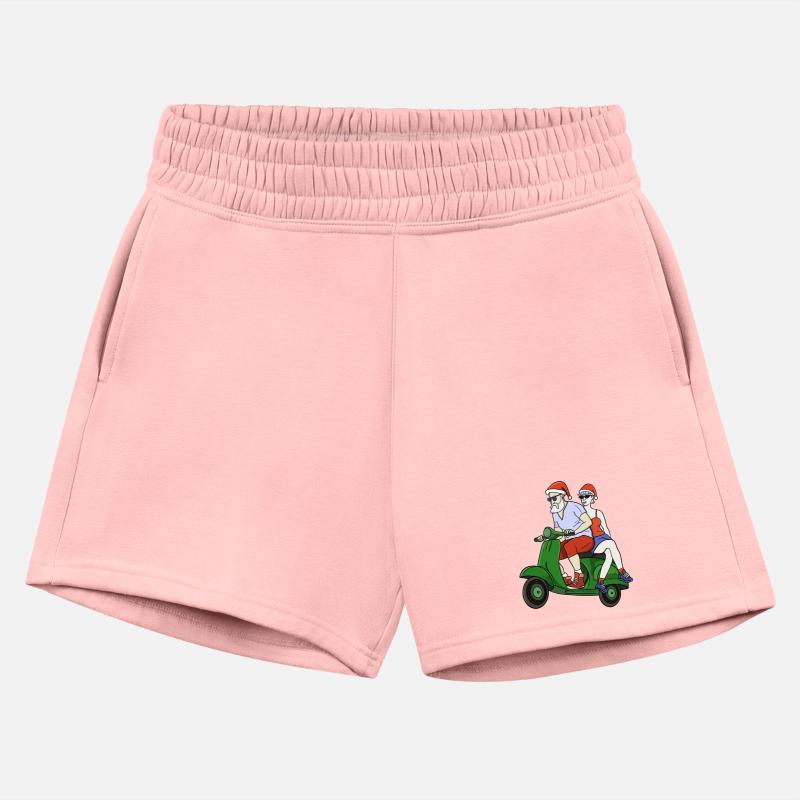 Santa and Mrs. Claus riding a scooter