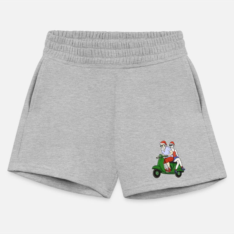 Santa and Mrs. Claus riding a scooter