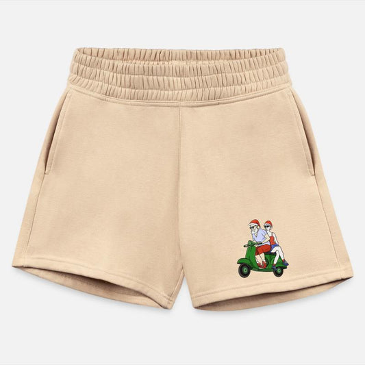 Santa and Mrs. Claus riding a scooter